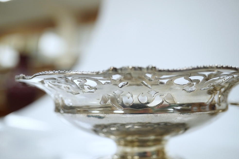 Two graduated pairs of George V pierced silver bon bon dishes, makers Mappin & Webb, 1924, diameter 13cm and 9cm, 17oz. Condition - good